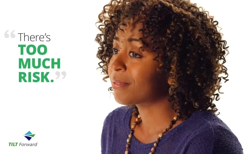 Still from the TILT Forward video: a woman with curly hair and a purple sweater beside the quote There’s too much risk.